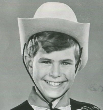 Black-and-white portrait of Charles Herbert as a child actor wearing a cowboy hat and smiling.