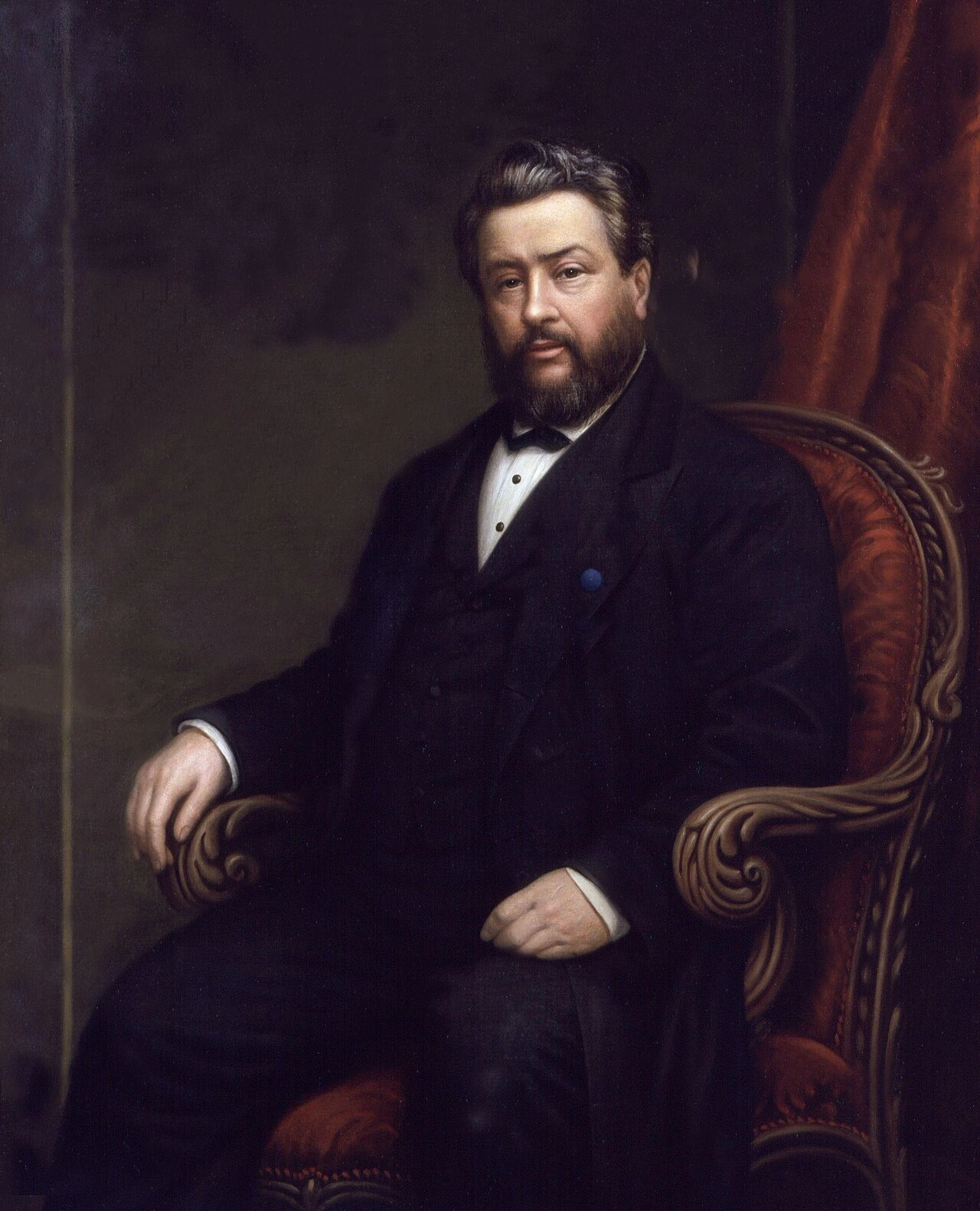 Portrait of Charles Haddon Spurgeon seated in a chair